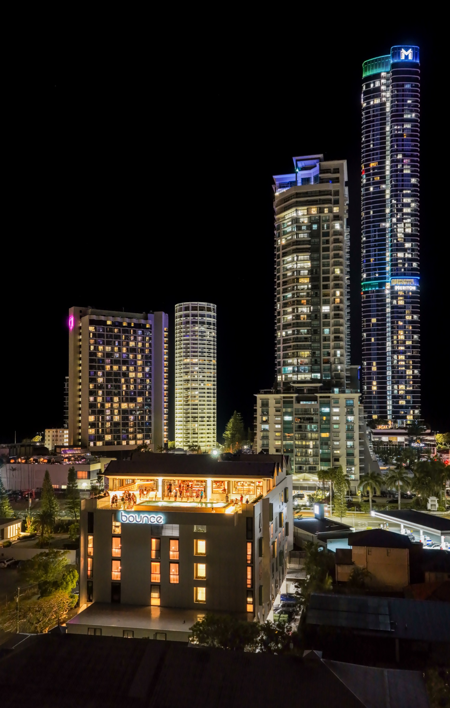 The illuminated Bounce rooftop with the Surfers Paradise skyline behind it